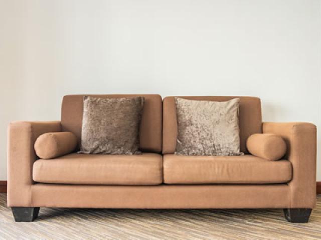 Brown sofa with 2 pillows for your living room comfort